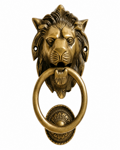An antique brass lion head door knocker with a matching ring pull and decorative wall plate, shown against a plain white background.