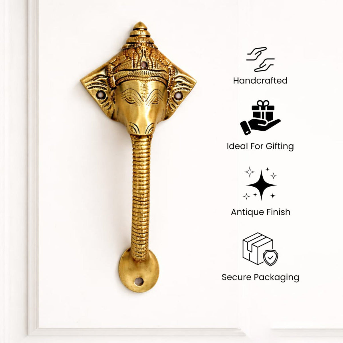 Decorative brass handle with features.