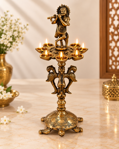 Brass Krishna Diya Stand with 7 Oil Holders – Antique Finish | The Indian Aura