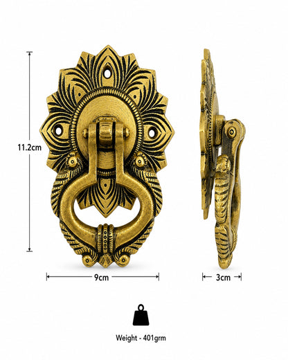 An ornate antique-style brass door knocker with a floral sunburst design and a hanging ring, shown from front and side views with dimension labels (11.2cm, 9cm, 3cm) and weight (401grm) on a white background.
