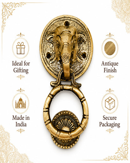 An antique-style brass elephant head door knocker with a hanging ring, presented on a white background with decorative gold corner flourishes and text callouts reading 'Ideal for Gifting,' 'Antique Finish,' 'Made in India,' and 'Secure Packaging.'.