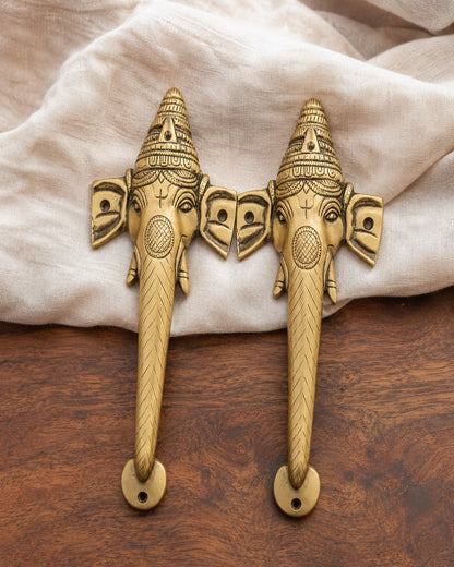 Pair of brass ganesha door handles.