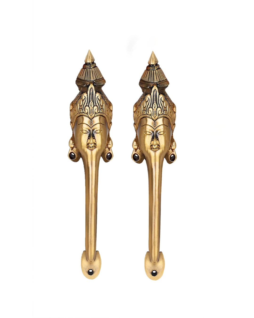 Pair of brass door handles with face designs on a white background.