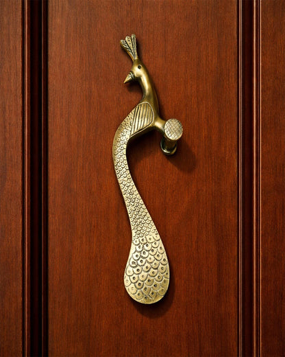 Brass peacock door handle.