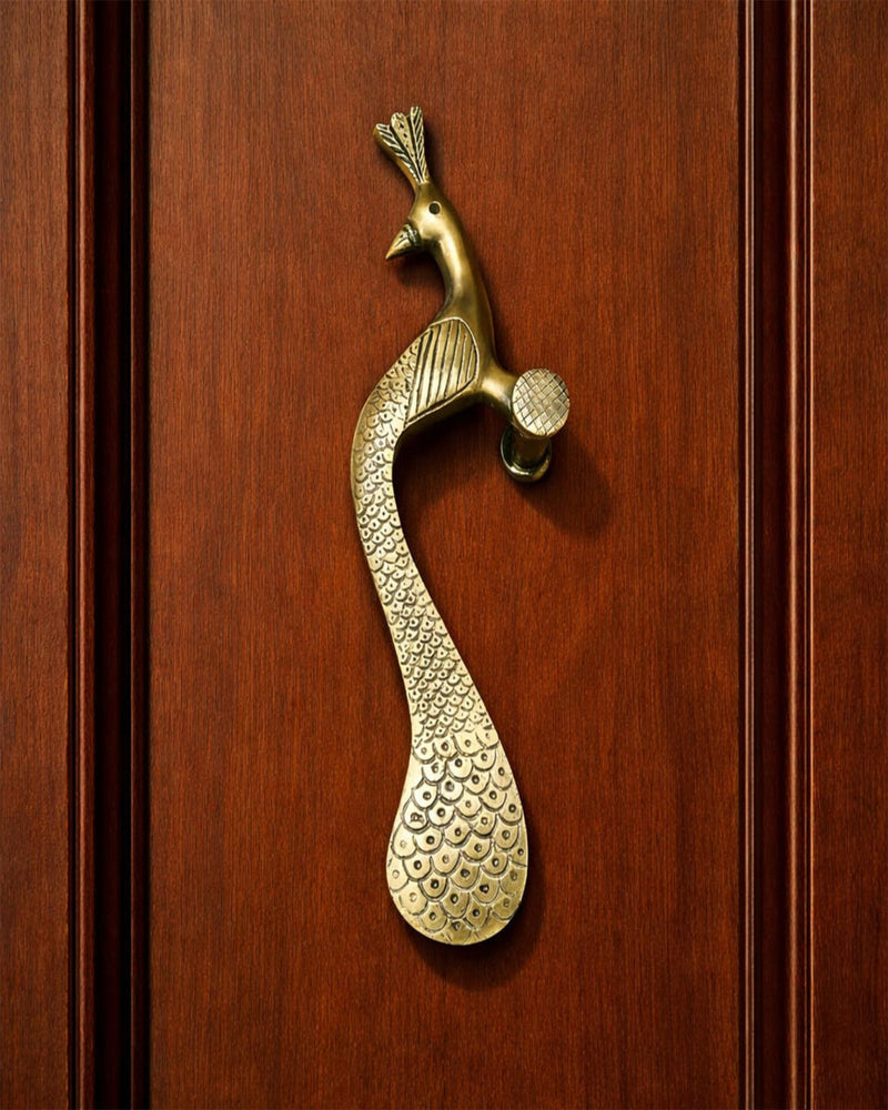 Brass peacock door handle.