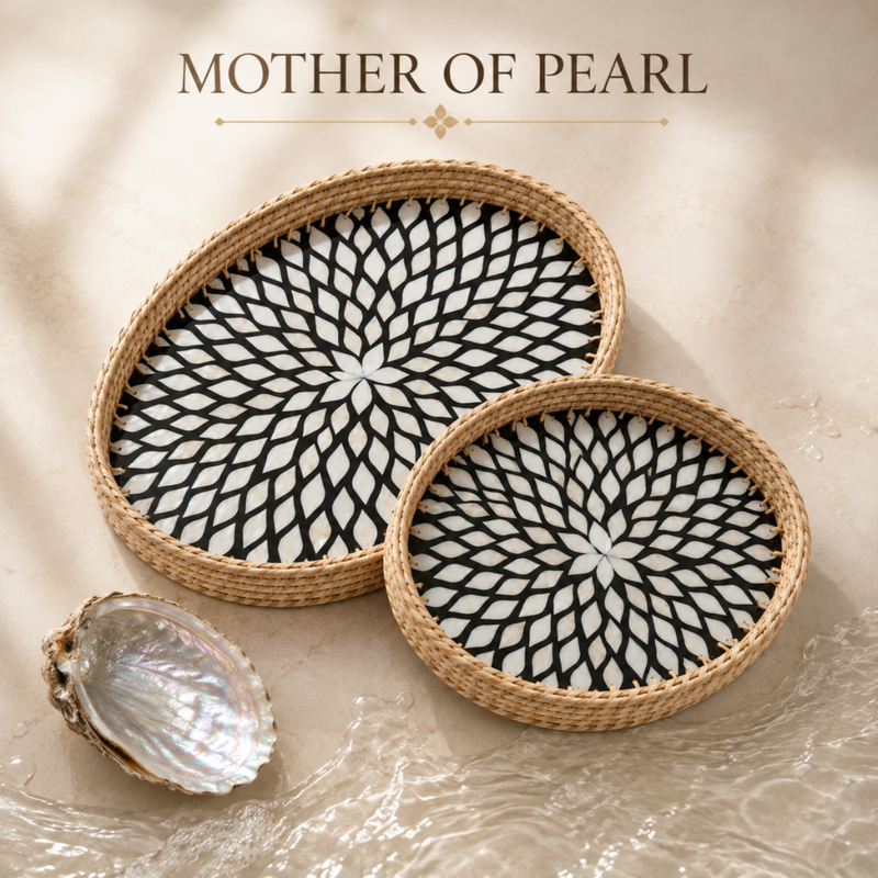 Two oval woven trays with black and white geometric floral patterns on a beige background, with a mother of pearl shell shell and the text 'MOTHER OF PEARL' at the top.