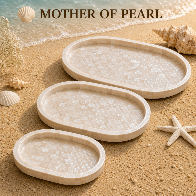 Three oval mother-of-pearl trays arranged on a sandy beach with shells and starfish, under the text 'MOTHER OF PEARL' at the top.