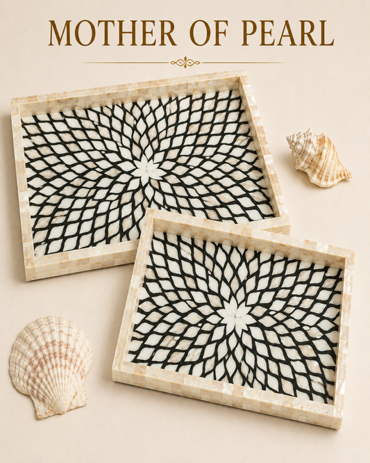 Two rectangular mother-of-pearl trays with a black and white geometric spiral pattern, displayed on a beige background with decorative seashells and the text 'MOTHER OF PEARL' at the top.