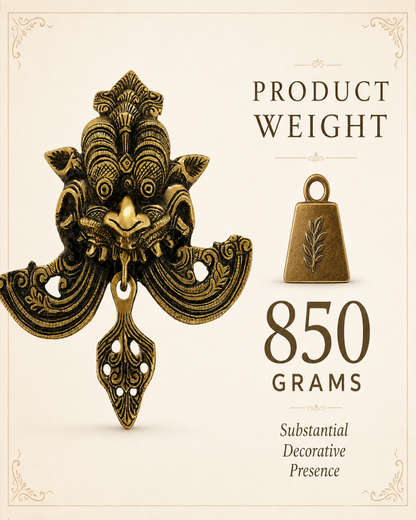 An ornate antique-style bronze decorative pendant or charm shown on a cream background with text reading 'PRODUCT WEIGHT 850 GRAMS' and a small bell-shaped weight icon.