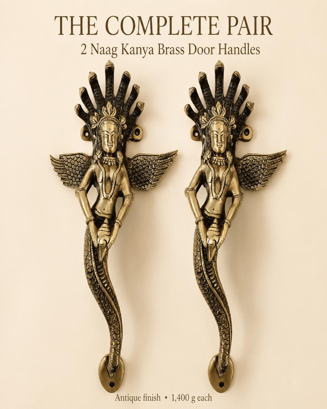 A pair of antique brass door handles shaped like dancing winged female figures with a serpent-like lower body, shown on a beige background with text reading 'THE COMPLETE PAIR 2 Naag Kanya Brass Door Handles' and 'Antique finish 1,400 g each'.