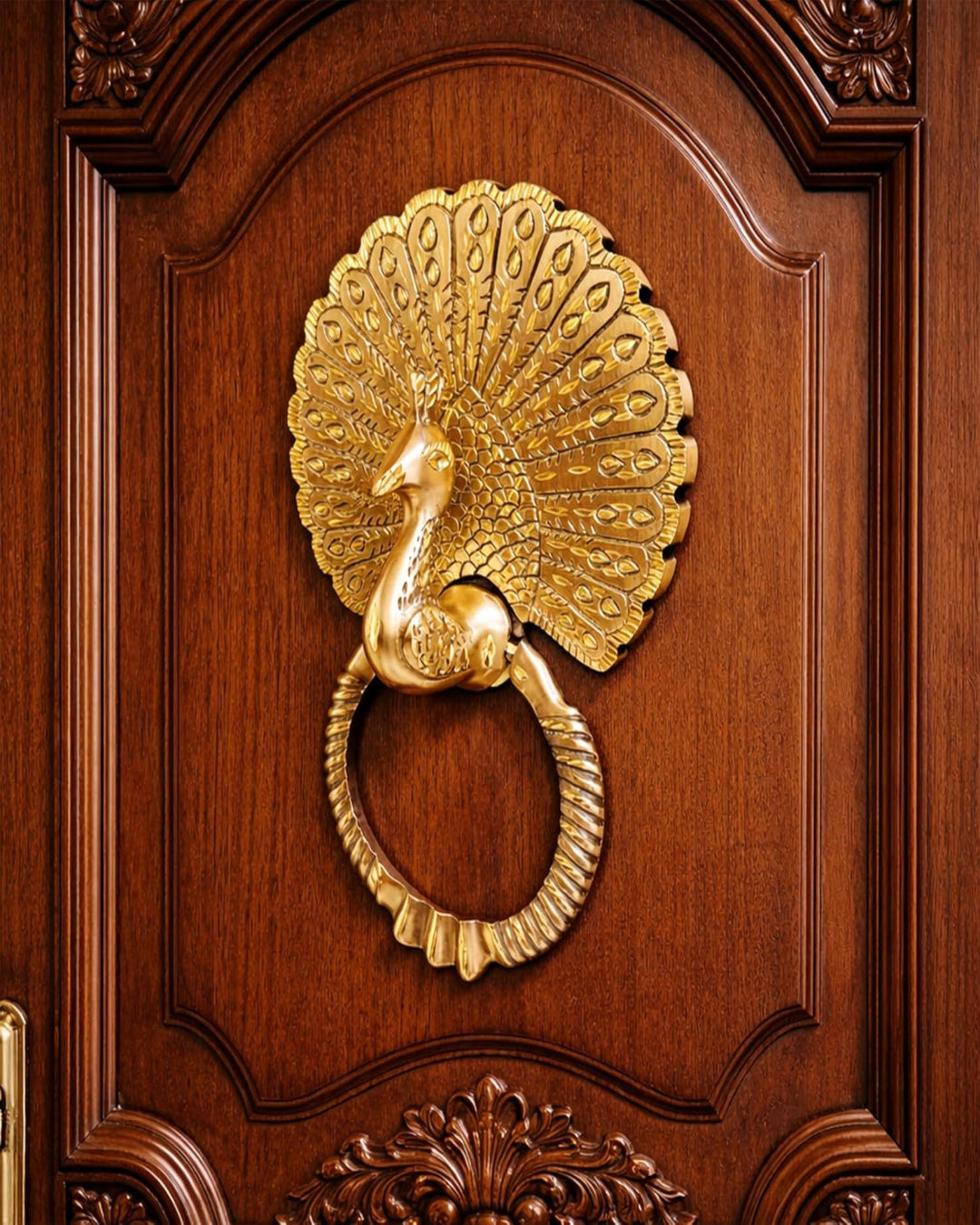 Gold peacock door knocker on a wooden door