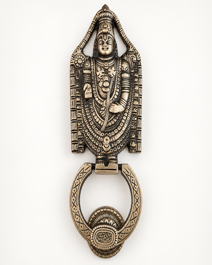 An ornate antique bronze door knocker featuring a detailed relief carving of a Hindu deity, shown on a plain white background.