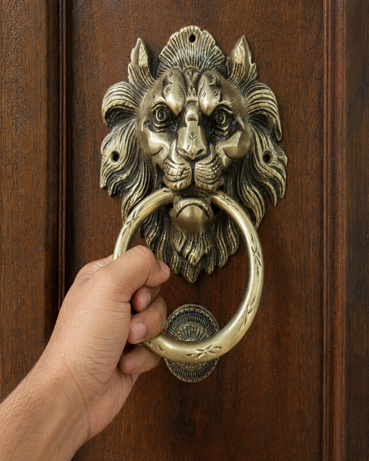 lion door knocker on a wooden door.